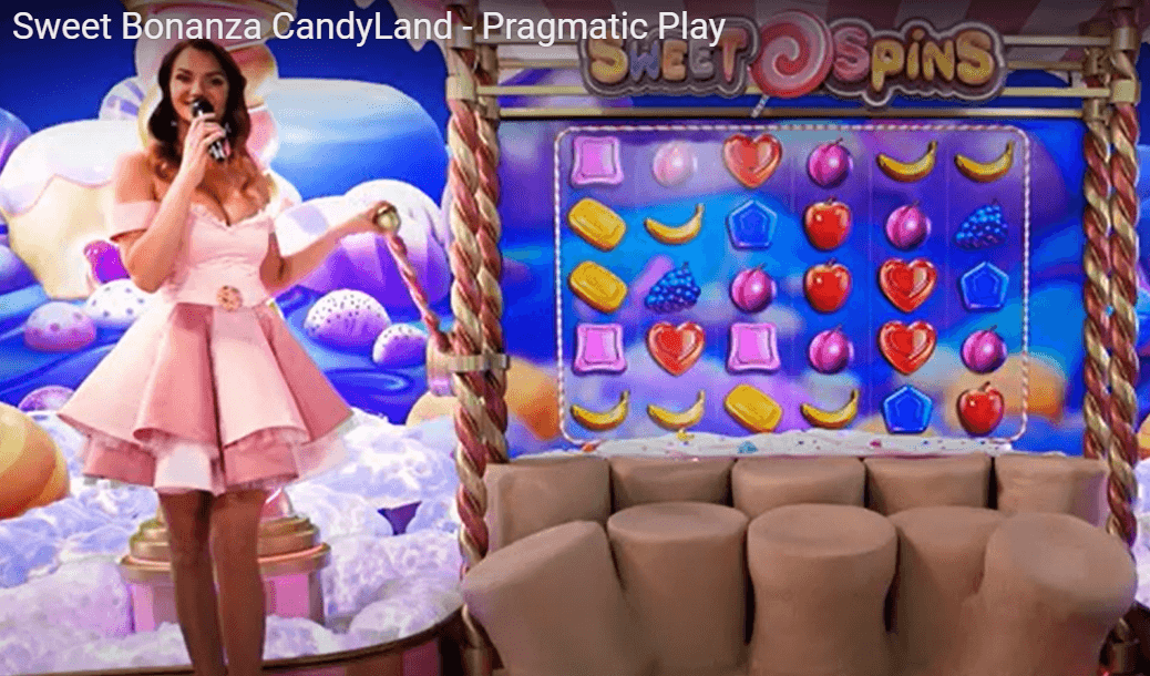 Sweet Bonanza Candyland Live game show hosted by a presenter, featuring colorful candy symbols and spinning wheel gameplay by Pragmatic Play.