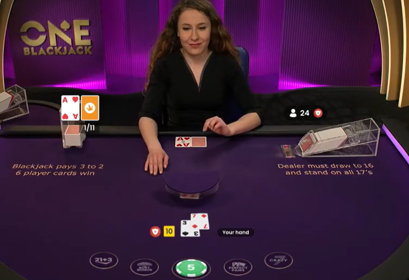 ONE Blackjack by Pragmatic Play offers a unique single-hand format, fast betting windows, side bets, and a Six-Card Charlie rule.